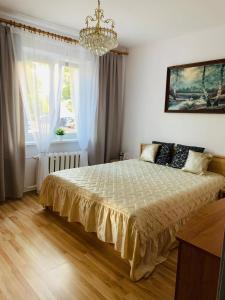 Ένα ή περισσότερα κρεβάτια σε δωμάτιο στο Apartament 2 pokojowy Gdańsk