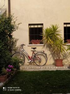 a bike parked in front of a building at La Ritonda in Revine Lago