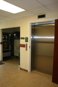 an elevator in an office building with a door at Yellowstone Lodge in West Yellowstone