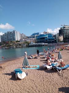 a group of people laying on a beach at Bayview in Pembroke 