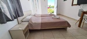 Postel nebo postele na pokoji v ubytování Soula appartments