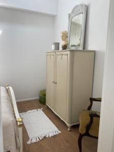 a bedroom with a mirror on top of a dresser at Am Lenzensberg 667 - Neu mit E-Ladestation in Traunstein