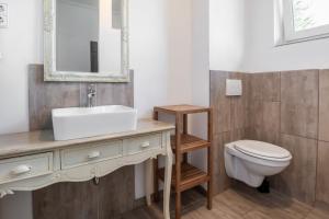 a bathroom with a sink and a toilet at Bett im Bahnhof Güterschuppen keine JA oder ähnlich in Bad Harzburg +18 photos