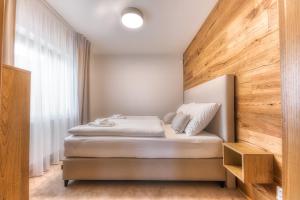 Postel nebo postele na pokoji v ubytování Apartmány Filipovice