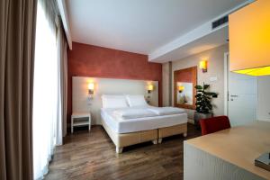 A bed or beds in a room at H2O ROOMS