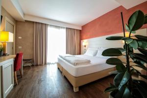 A bed or beds in a room at H2O ROOMS