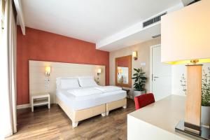 A bed or beds in a room at H2O ROOMS