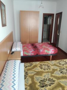 Postel nebo postele na pokoji v ubytování HOSTAL RESIDENCIA PRESIDENTE