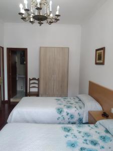 Postel nebo postele na pokoji v ubytování HOSTAL RESIDENCIA PRESIDENTE