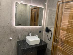 a bathroom with a sink and a mirror at Villa Mery in Moisei +37 photos