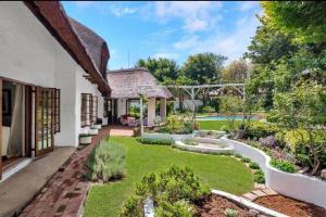 an image of a garden in a house at Libra Lodge & Spa - Randburg, Johannesburg in Sandton