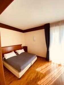 Postel nebo postele na pokoji v ubytování Hotel Bellevue