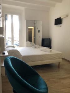 Postel nebo postele na pokoji v ubytování PORTOROSSO Rooms