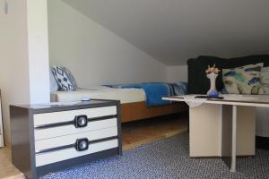 Postel nebo postele na pokoji v ubytování Apartmani Kate