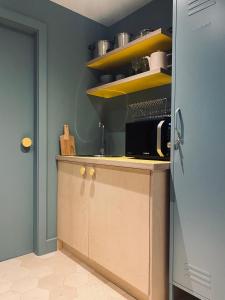 a kitchen with a counter with a microwave on it at Studio 22 in Harrogate