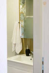 a bathroom with a sink and a mirror at La Vita Apartment 2 in Ohrid