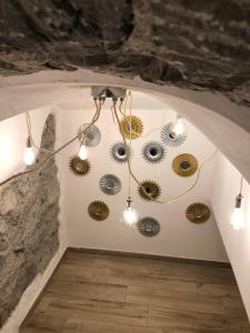 a room with a bunch of lights on the wall at PORTOROSSO Rooms in Vernazza