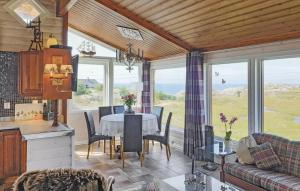a kitchen and dining room with a table and chairs at Skudeneshavn 182 Fish Camp in Syre