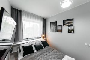 En eller flere senge i et værelse på Perła Bieszczad 2