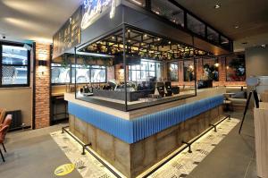 a restaurant with a bar in the middle at BoStay Hotel in Istanbul
