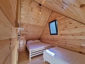 Posteľ alebo postele v izbe v ubytovaní Domek Clonowo