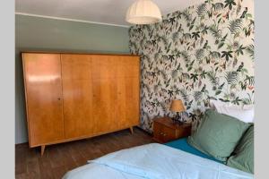 Llit o llits en una habitació de LE FIFTIES