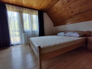 Postel nebo postele na pokoji v ubytování Vikendica Vera