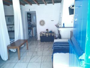 a room with a table and a tableasteryasteryasteryasteryasteryasteryasteryastery at Ioanna's in Panormos