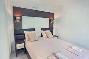 A bed or beds in a room at David apartments and rooms