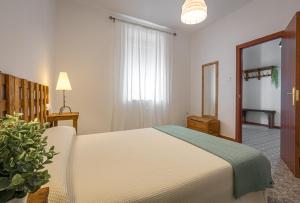 A bed or beds in a room at La Vaquería