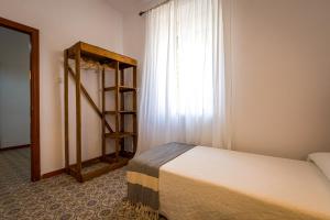A bed or beds in a room at La Vaquería