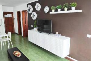 A television and/or entertainment centre at Apartamento BellAloe