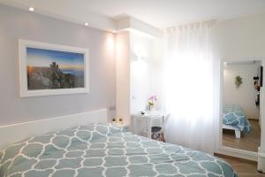 Postel nebo postele na pokoji v ubytování B&B Residenza Aragonese