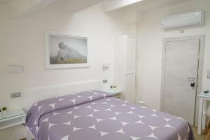 Postel nebo postele na pokoji v ubytování B&B Residenza Aragonese