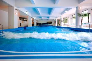 a swimming pool with a wave in the middle at Rusutsu Resort Hotel & Convention in Rusutsu