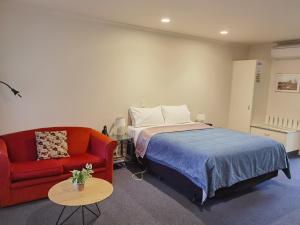 Voodi või voodid majutusasutuse Harringtons Motor Lodge toas