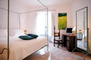 Katil atau katil-katil dalam bilik di La Locanda Delle Donne Monache