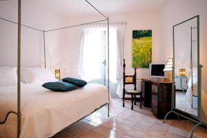 Postel nebo postele na pokoji v ubytování La Locanda Delle Donne Monache + 37 fotografií