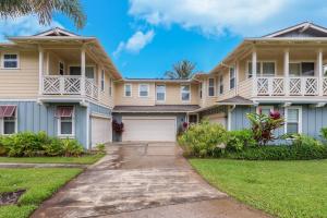 a large apartment building with a driveway at North Shore Kauai Hideaway condo in Princeville