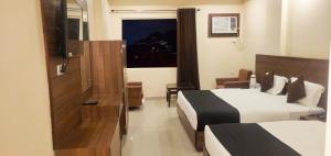 Hotel The Vaishno Devi Hills客房内的一张或多张床位