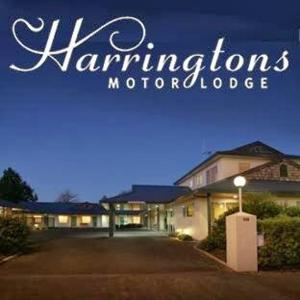 a sign for a mansions morocco at Harringtons Motor Lodge in Palmerston North
