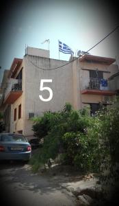 a building with the number on the side of it at ΜΚA House - λειτουργεί υπό νέα διεύθυνση 2024 in Galatas