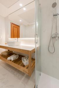 a bathroom with a sink and a shower at Toboso Apar - Turis in Nerja