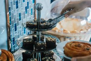 a person using a spoon to eat chocolate desserts at GLOW Pattaya in Pattaya South