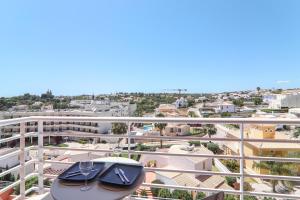 a view of the city from the balcony of a apartment at Quinta dos Arcos Lote 18 3ºg in Armação de Pêra