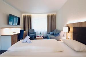 Postel nebo postele na pokoji v ubytování Hotel Residenz WALDOASE