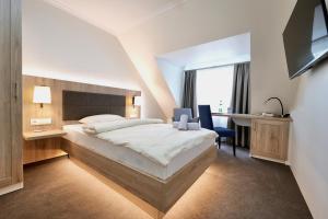 Postel nebo postele na pokoji v ubytování Hotel Residenz WALDOASE