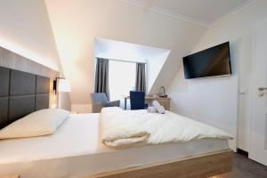 Postel nebo postele na pokoji v ubytování Hotel Residenz WALDOASE