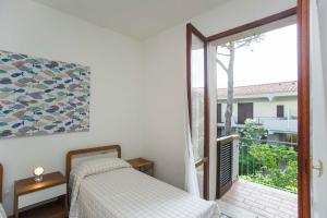 A bed or beds in a room at Il Gabbiano Piano Terra - Goelba