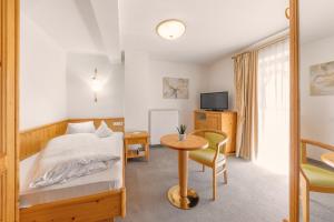 Voodi või voodid majutusasutuse Garni Hotel Am Meilenstein toas